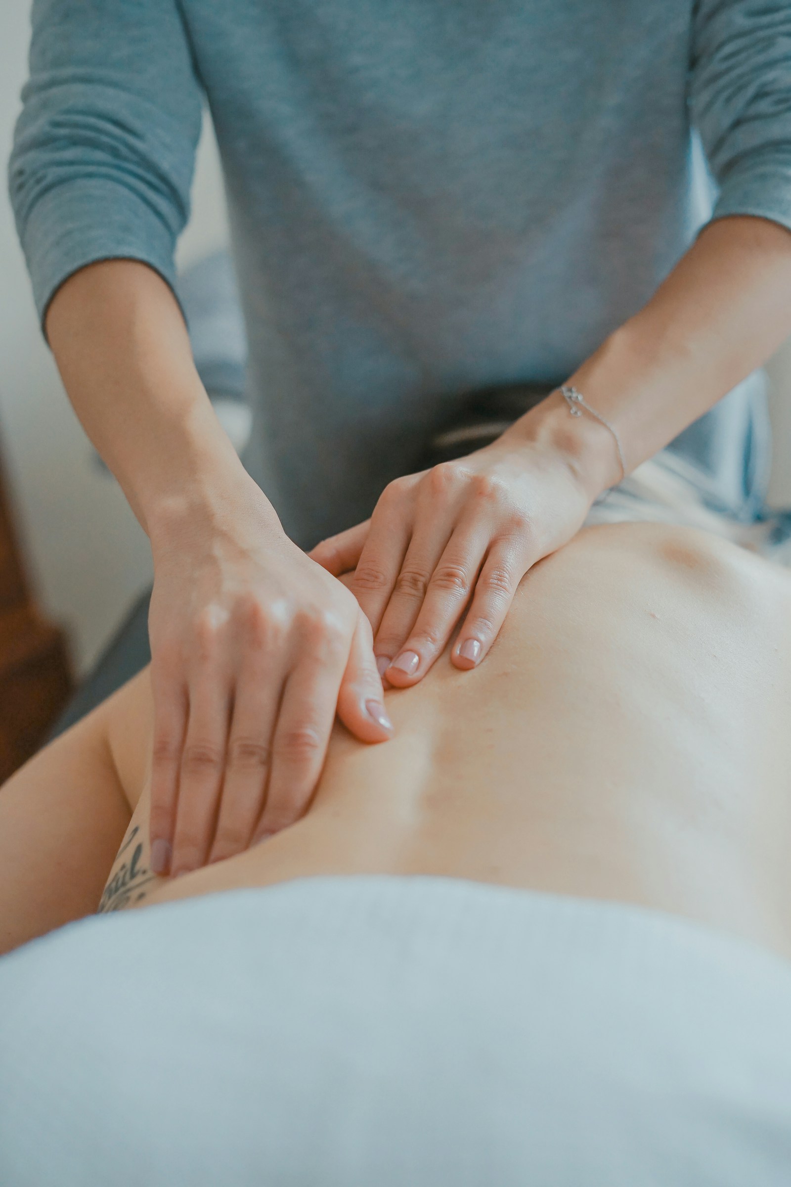Hands performing a relaxation massage